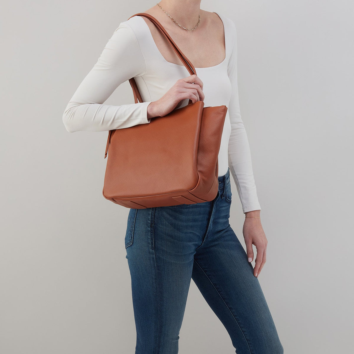 Essential Medium Tote In Soft Saffiano Leather - Lion | HOBO