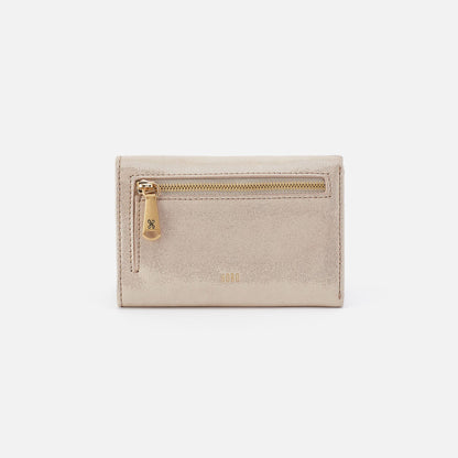 Jill Trifold Wallet In Metallic Leather - Sand Shimmer | HOBO