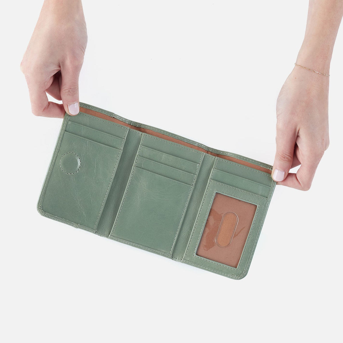 Jill Trifold Wallet In Polished Leather - Jade | HOBO