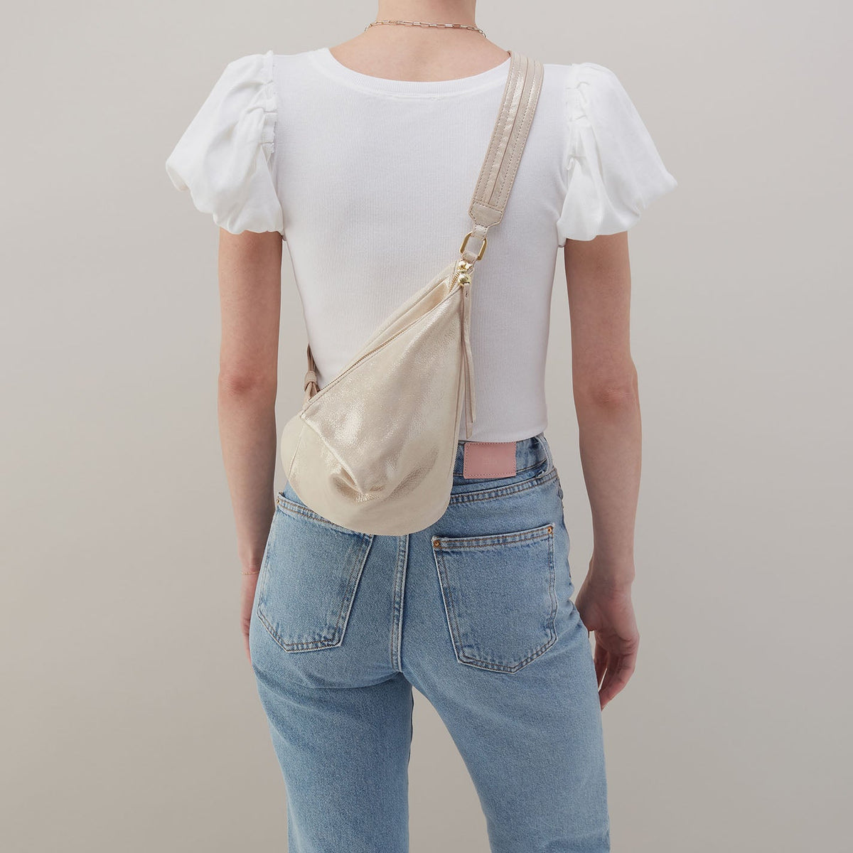 Sway Small Sling In Metallic Leather - Sand Shimmer | HOBO