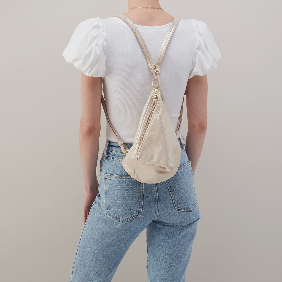 Sway Small Sling In Metallic Leather - Sand Shimmer | HOBO